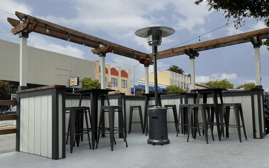 outdoor parklet seating area with single heat lamp